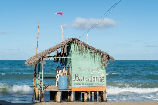 Maracaipe, Brazil - December 13, 2023: local beach hut with bar at the beach of Maracaipe, Brazil.