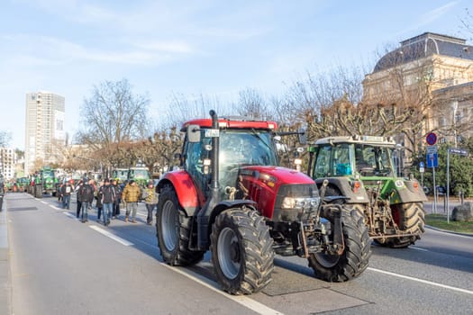 Wiesbaden, Germany - January 8, 2024: farmer with their tractors demonstrate for cutting down the price for diesel fuel and against the german government.