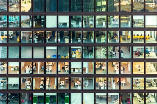 Frankfurt, Germany - February 1, 2024: facade view of an office building in Frankfurt with people working in the office.