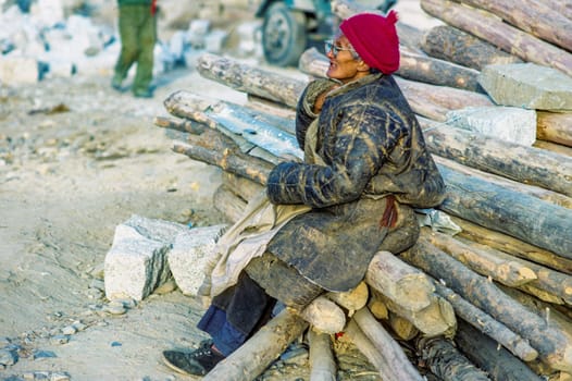 Lhasa, China - December 20, 1984: local people from the hills meet in the old part near the Jokhan palace on Dec 20.1984 in Lhasa, China. They sell meat on open air butchery.