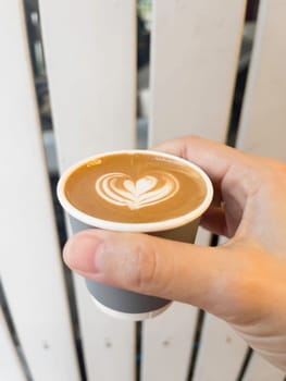 Cup of hot latte art coffee, stock photo
