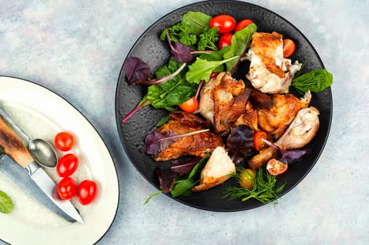 Sliced baked grilled chicken on a plate. Meat poultry.