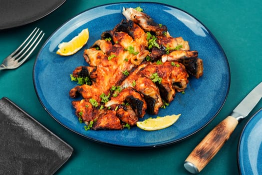 Baked cut mackerel fish in soy marinade. Top view. Copy space.