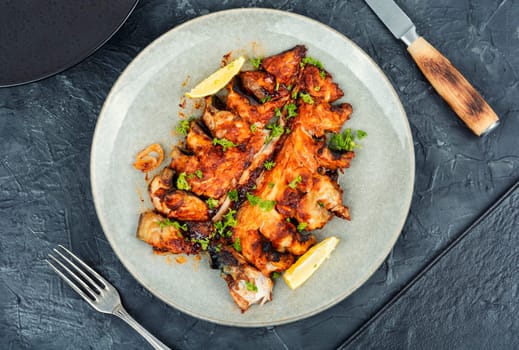 Baked cut mackerel fish in soy marinade. Top view. Copy space.