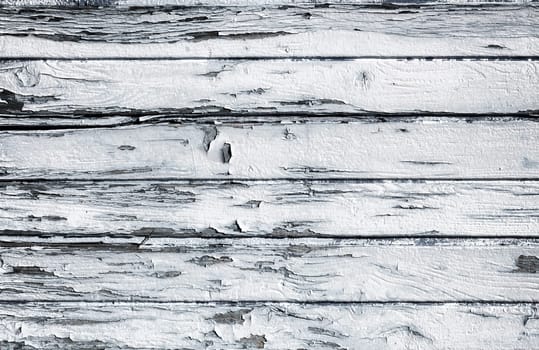 Wooden vintage white plank. Aged wooden wall. Ruined by time.