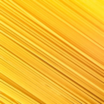 Background Spaghetti Pasta. Thin pasta arranged in rows. Yellow Italian pasta. Long spaghetti. Raw spaghetti wallpaper. Thin spaghetti. Food concept.