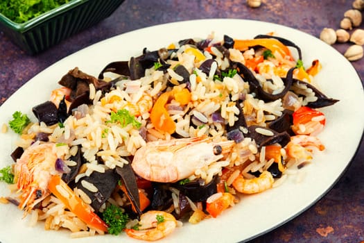 Shrimp fried rice serves on the dish. Thailand popular meal.