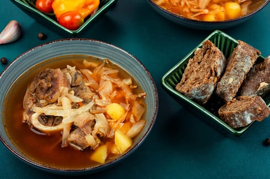 Traditional boiled Ukrainian soup borscht in bowl.