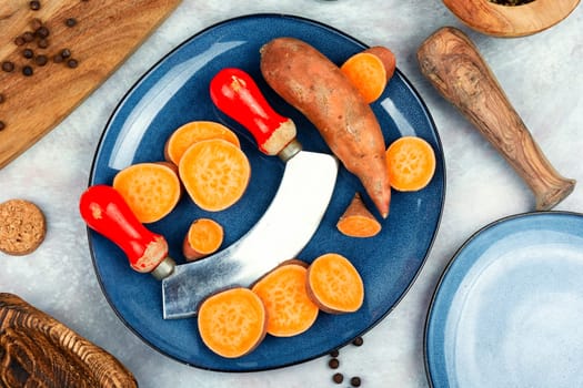 Sliced fresh sweet potatoes chunks for cooking. Orange kumara, yam. Healthy eating.