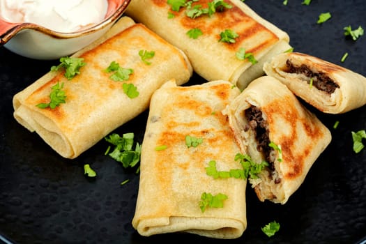 Pancake fried rolls stuffed with ground meat. Thin pancakes with fillings. Carnival, Shrovetide food.