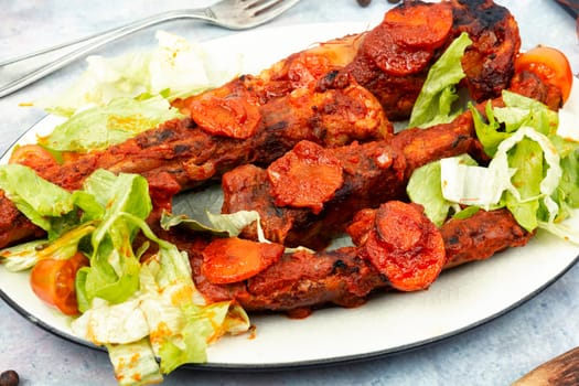 Braised pork ribs in tomato sauce. BBQ. Stew.