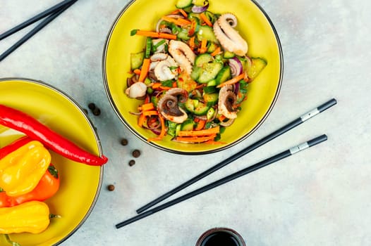 Salad of cucumber, onion and boiled octopus. Korean food. Korean cuisine with seafood