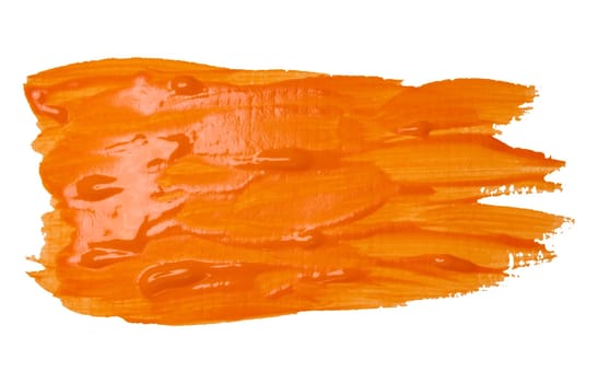 Watercolor brush stroke of orange paint on a white isolated background, close up