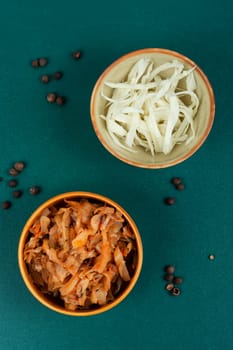 Appetizing stewed cabbage on the old wooden background. German cuisine. Rustic style.