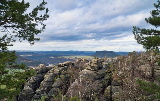 View from the Pfaffenstein in black and white. Forests, mountains, vastness, panorama. Landscape from the Elbe Sandstone Mountains.