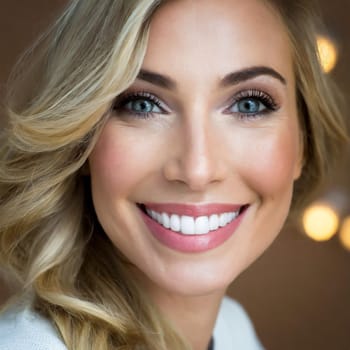 dental care concept for dentists and orthodontist - close up of a woman with a smile and perfect white teeth