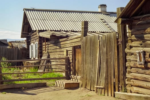 Old wooden buildings on the shores of Lake Baikal, Wooden house on the lake.