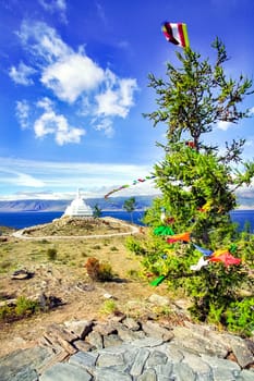 Colored ribbons on trees and pillars, superstition for good luck, Baikal traditions.