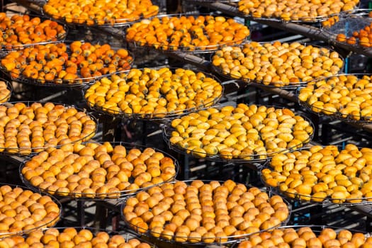 Dry Persimmon fruit production under sunshine in factory