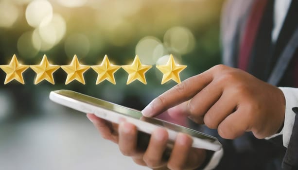 close up on customer man hand pressing on smartphone screen with gold five star rating feedback icon and press level three rank (good) for give score point to review the service business concept