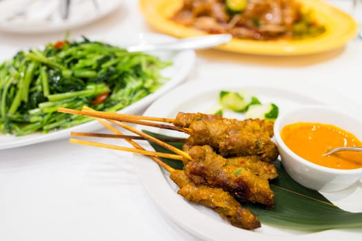 Check meat satay dish in restaurant