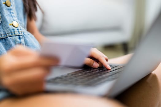 Woman use laptop computer for shopping online with credit card at home