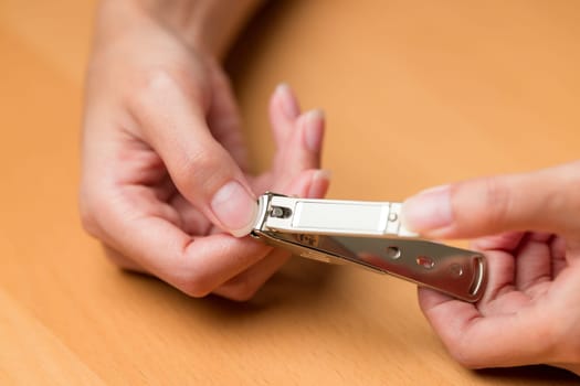 Hand manicure with nail clipper
