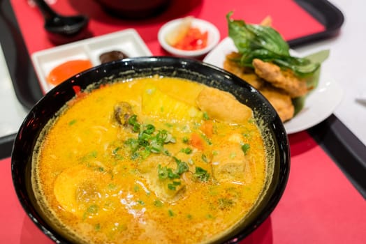 Curry noodles bowl in the restaurant