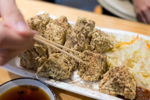Deep fry stinky tofu on the white dish