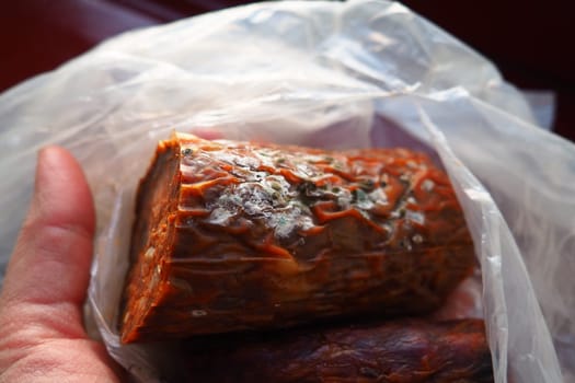 Raw smoked sausage became moldy while it was in a plastic bag. A mold or mould. The dust-like, colored appearance of molds is due to the formation of spores containing fungal secondary metabolites