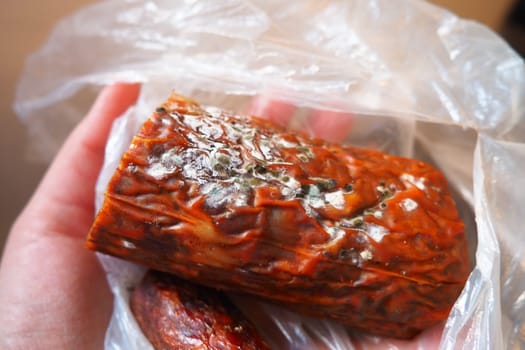 Raw smoked sausage became moldy while it was in a plastic bag. A mold or mould. The dust-like, colored appearance of molds is due to the formation of spores containing fungal secondary metabolites