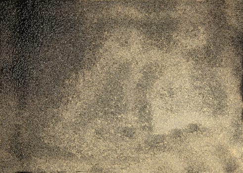 The brown background texture of the glossy rough surface of the wall with spots and relief particles in close-up