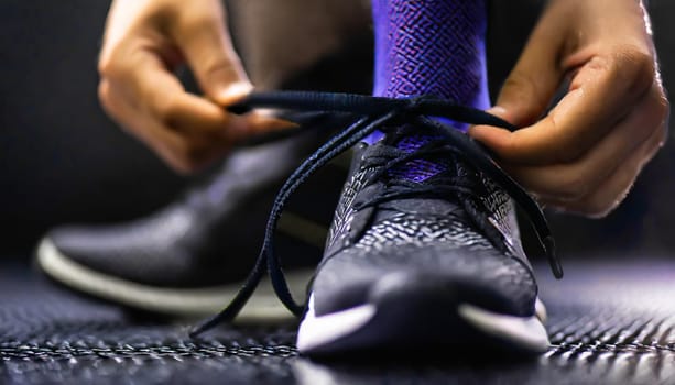 Tying sports shoes