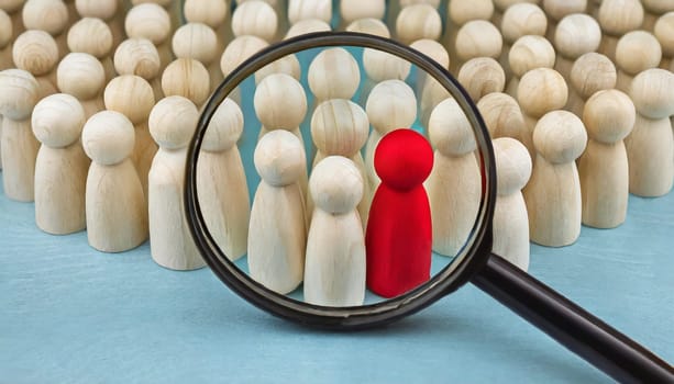 Wooden figures of people are lying on a white background. Social network. Business. The concept of human resources management. Headhunters. Search for people to work. The search for the second half.