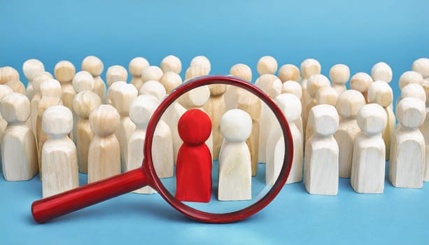 Wooden figures of people are lying on a white background. Social network. Business. The concept of human resources management. Headhunters. Search for people to work. The search for the second half.