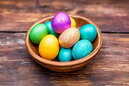Vibrant Easter Eggs. A close-up image of colorful and intricately decorated Easter eggs arranged in a beautiful pattern on a rustic wooden background, emphasizing the unique designs and textures.