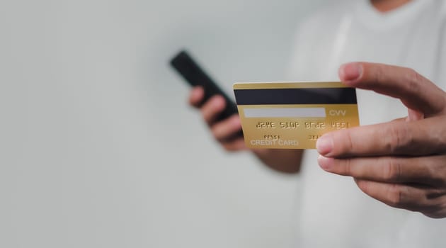 Online payment, Man using mobile smartphone and credit card for online shopping, Digital online payment concept, Technology online banking applications via internet network, financial transaction.