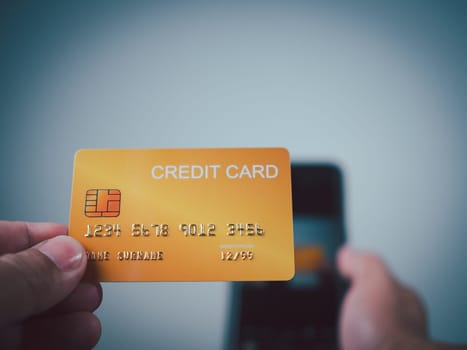 Online payment, Man using mobile smartphone and credit card for online shopping, Digital online payment concept, Technology online banking applications via internet network, financial transaction.