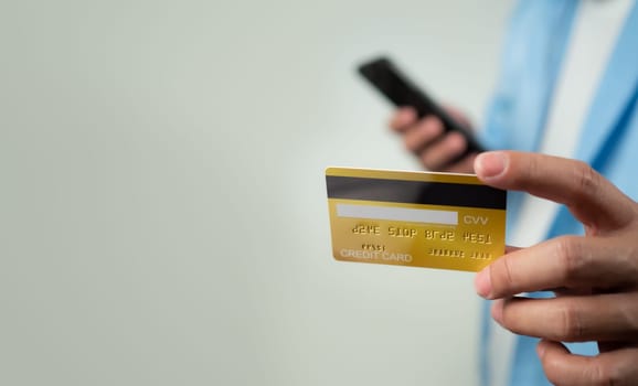 Online payment, Man using mobile smartphone and credit card for online shopping, Digital online payment concept, Technology online banking applications via internet network, financial transaction.