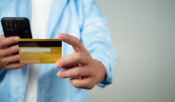 Online payment, Man using mobile smartphone and credit card for online shopping, Digital online payment concept, Technology online banking applications via internet network, financial transaction.