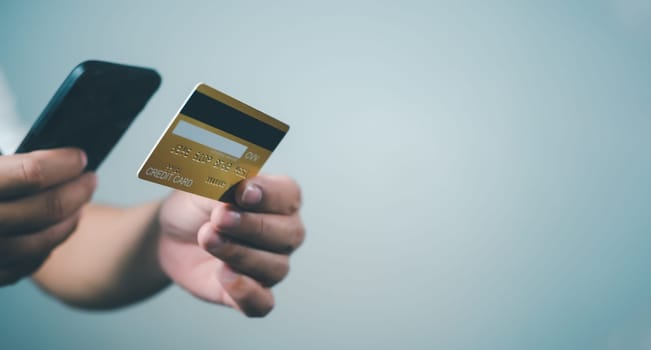 Online payment, Man using mobile smartphone and credit card for online shopping, Digital online payment concept, Technology online banking applications via internet network, financial transaction.