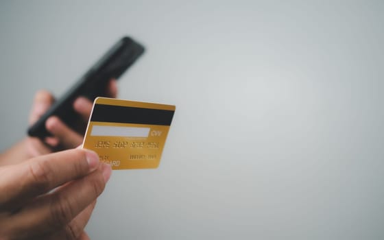 Online payment, Man using mobile smartphone and credit card for online shopping, Digital online payment concept, Technology online banking applications via internet network, financial transaction.