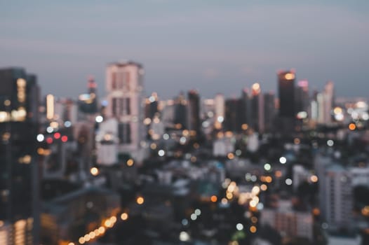 Cityscape blurred abstract background with bokeh urban lights in retro process effect