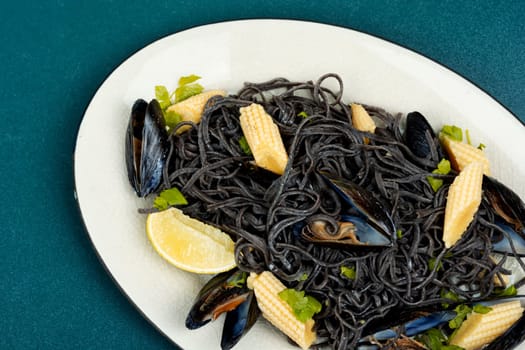 Vegan black bean pasta with mussels. Spaghetti with seafood.