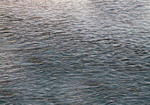 Artistic work of hand-drawn water with blue waves close-up from above
