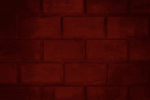 Background texture of a red brick wall with darkened edges and dirty surface close-up