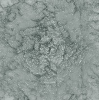 Background texture of a rough surface with a wavy pattern on a gray background close-up