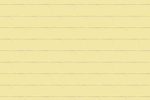 Background image of a wide decorative yellow brick wall in close-up