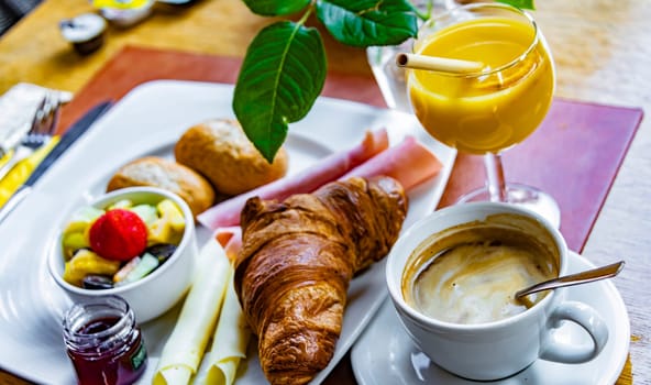 Breakfast served with coffee, orange juice and croissants.