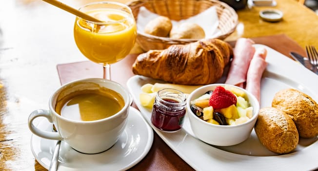 Breakfast served with coffee, orange juice and croissants.